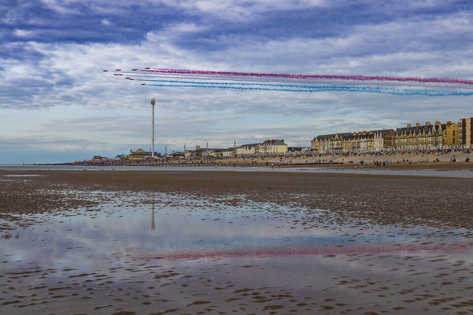 A photograph of the red arrows flying display over Rhyl beach